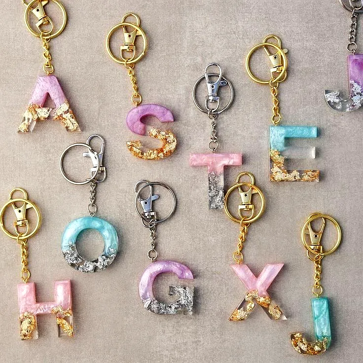 Resin keychain India Custom alphabet keychain Gold glitter keyring Handmade resin jewelry Luxury purse accessory Trending keychains 2025