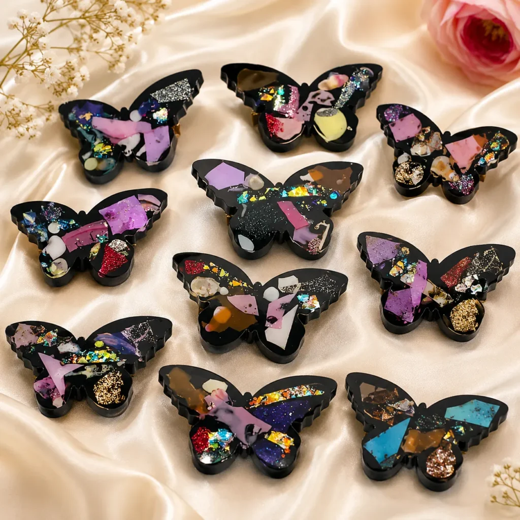 Black Butterfly shaped Hair Clips with Colorful Mosaic Glitter on Satin Background  Bling On