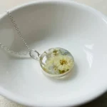 Bling On® Resin Real Flower Pendant White Daisy Orchid Charm India No1 Handmade Jewellery for Eco-Luxury Souls ✨ 1 1 • Bling On- Bling On® Resin Real Flower Pendant – White Daisy & Orchid Charm India No.1 Handmade Jewellery for Eco-Luxury Souls ✨ (1) (1)