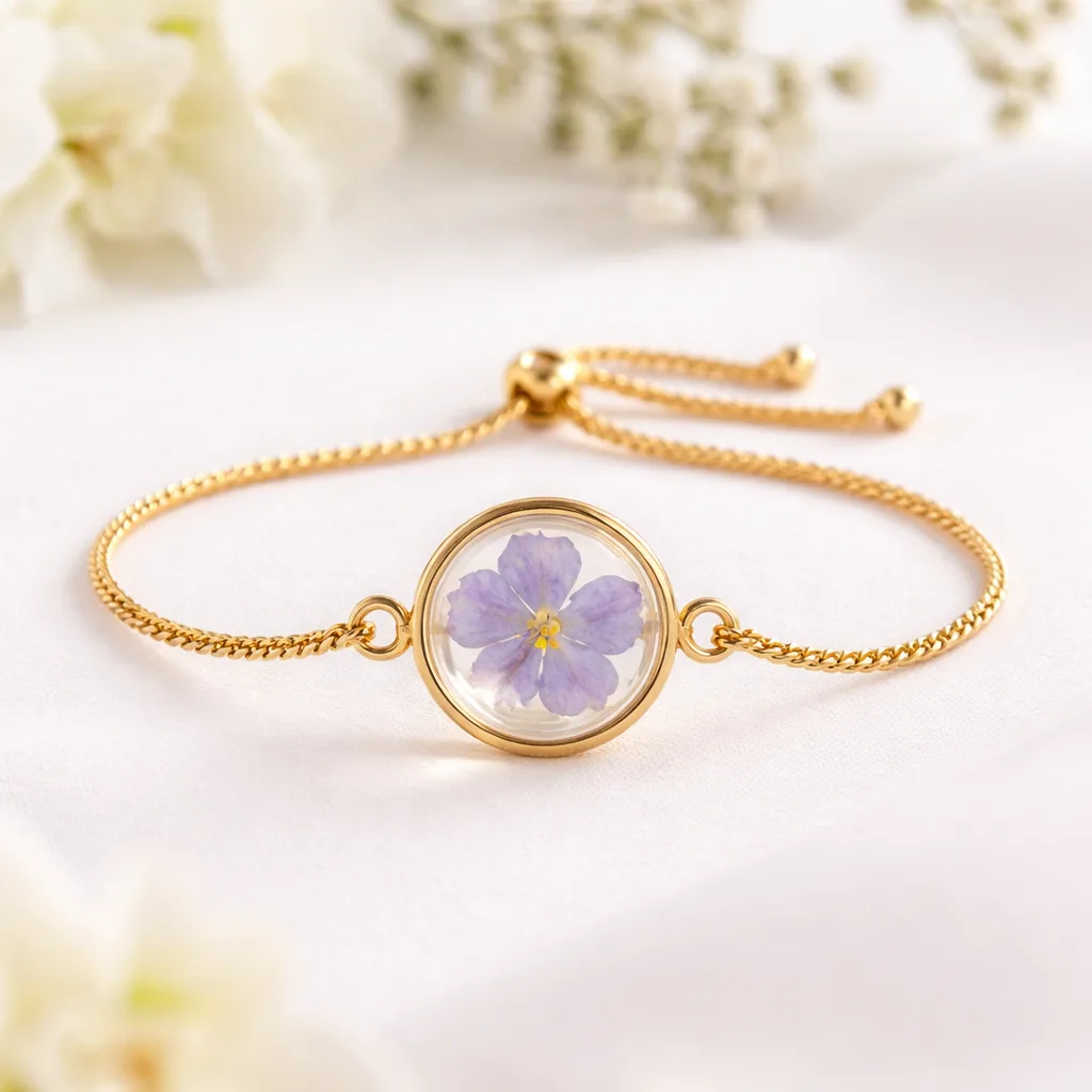 Real flower bracelet with purple preserved flower in resin pendant on gold chain