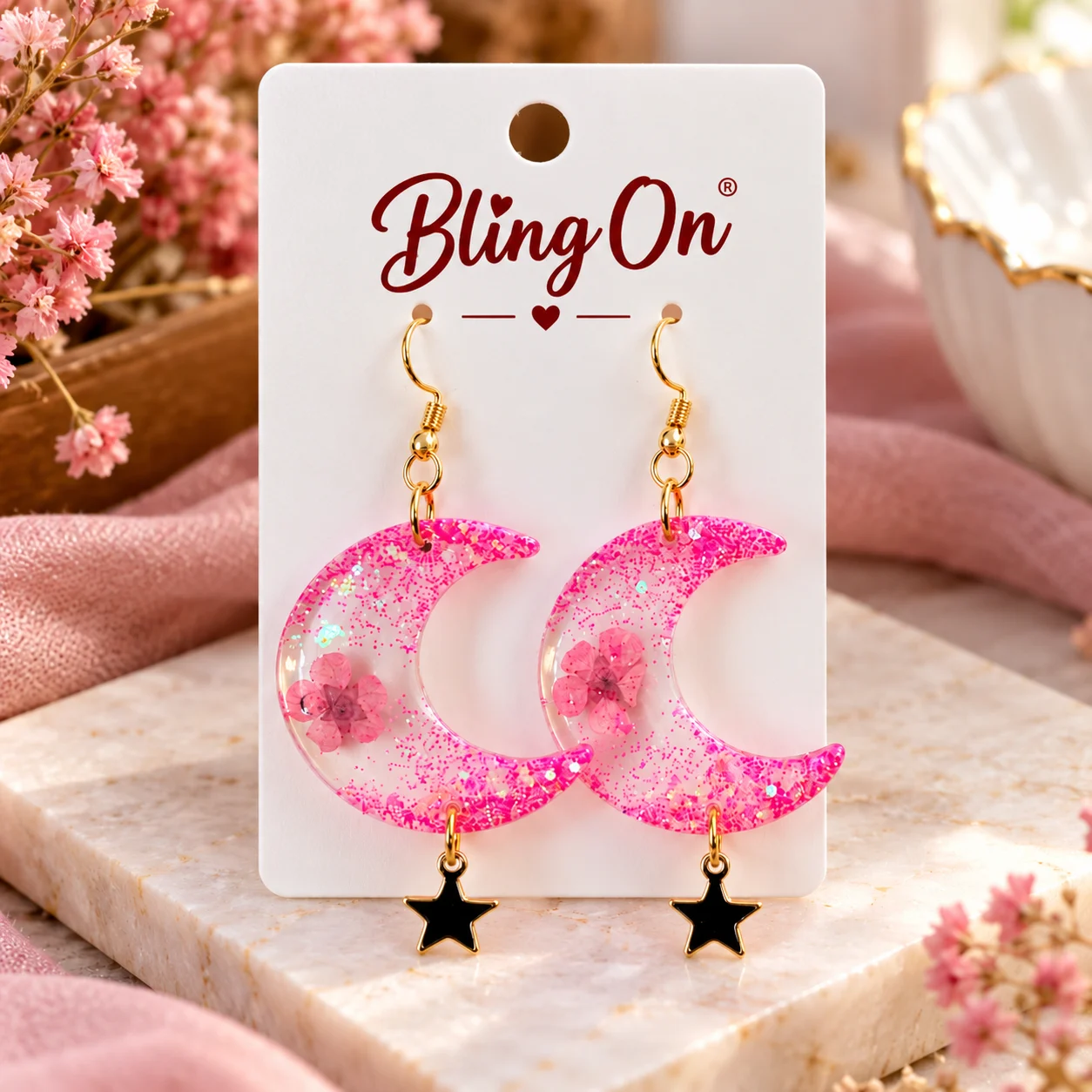 Bling on Pink Glitter Moon Earrings Bling On Pink Glitter Resin Crescent Moon Earrings with Floral Details Gold tone Hooks and Black Star Charms by Bling on Bling On